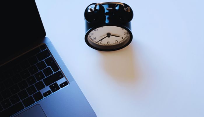 Laptop and table clock 